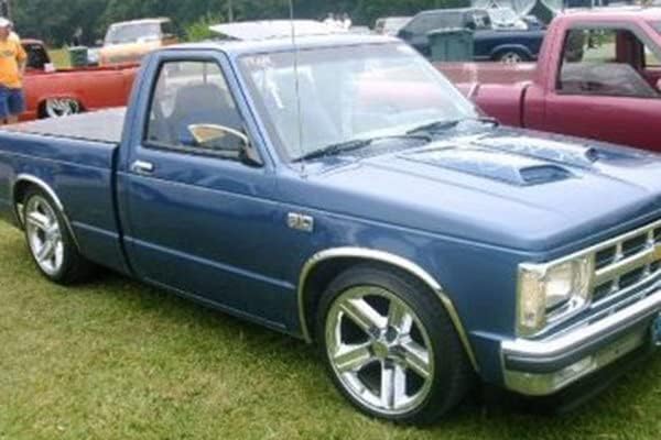 QMI 145003 - Fender Trim Compatible with Chevy S10 and GMC S15 Pickup (Full Arch) Mirror Polished Stainless Steel Wide Width Set Of 4